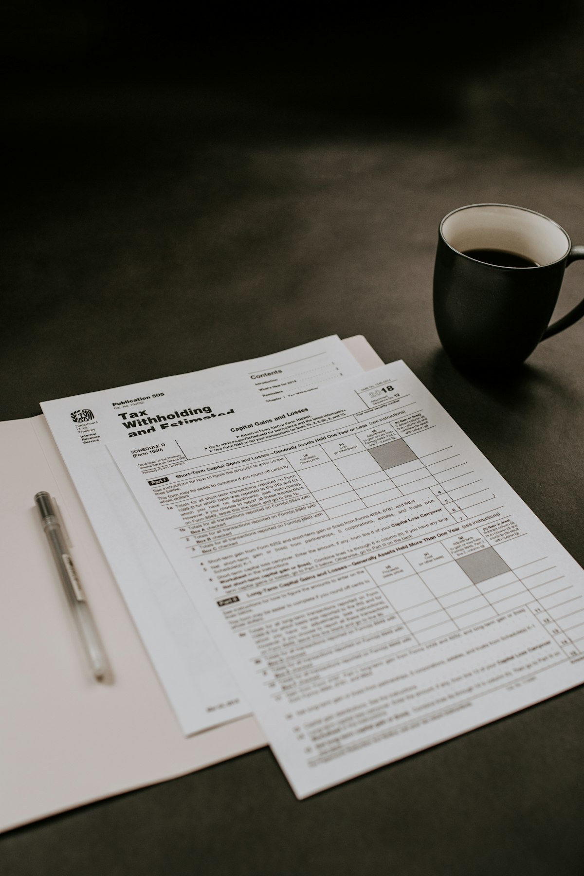 Financial documents and invoices on desk