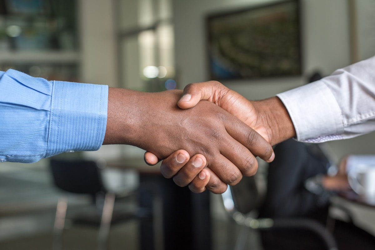 Professional handshake in modern office