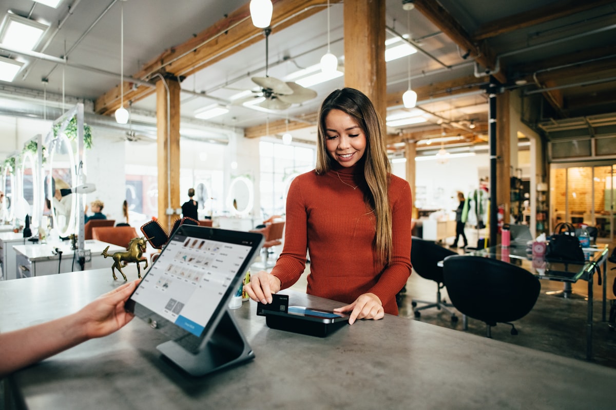 Small business owner using digital POS system