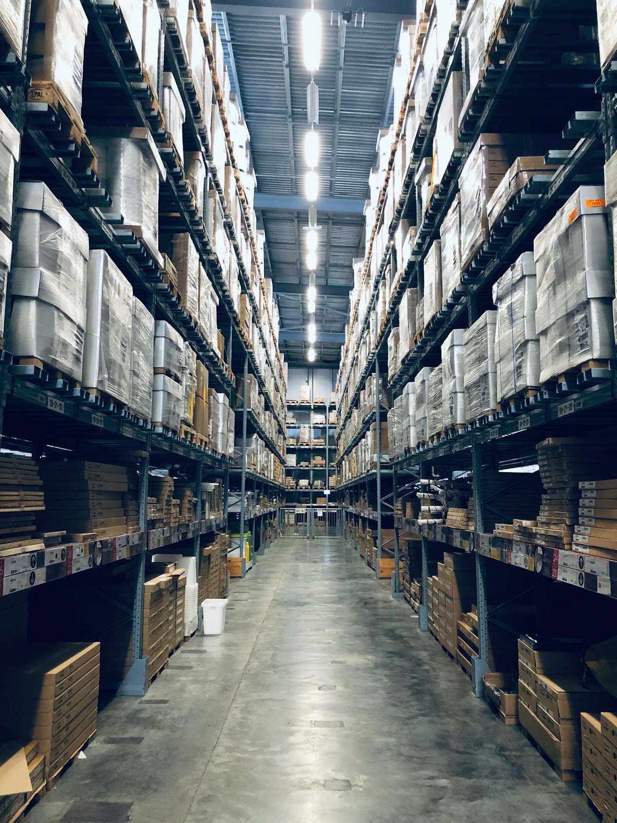 Worker scanning barcode on shipping packages